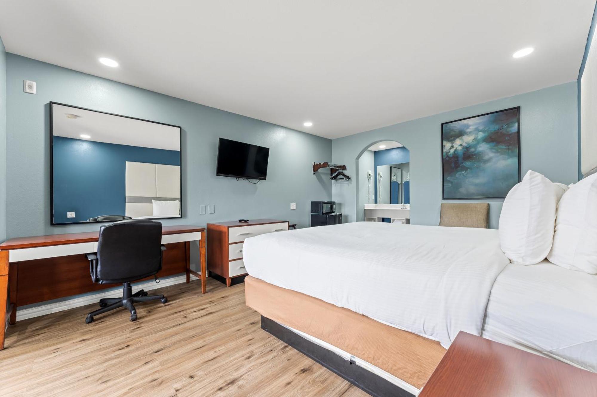 Executive Inn & Suites Magnolia Buitenkant foto